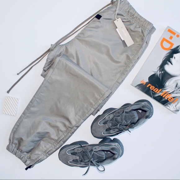 FEAR OF GOD ESSENTIALS ‘Desert Taupe’ Nylon Trackpants - Picture 1 of 4